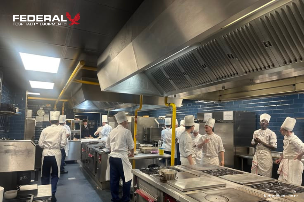Commercial Stainless Steel Range Hood Installed in a Professional Commercial Kitchen